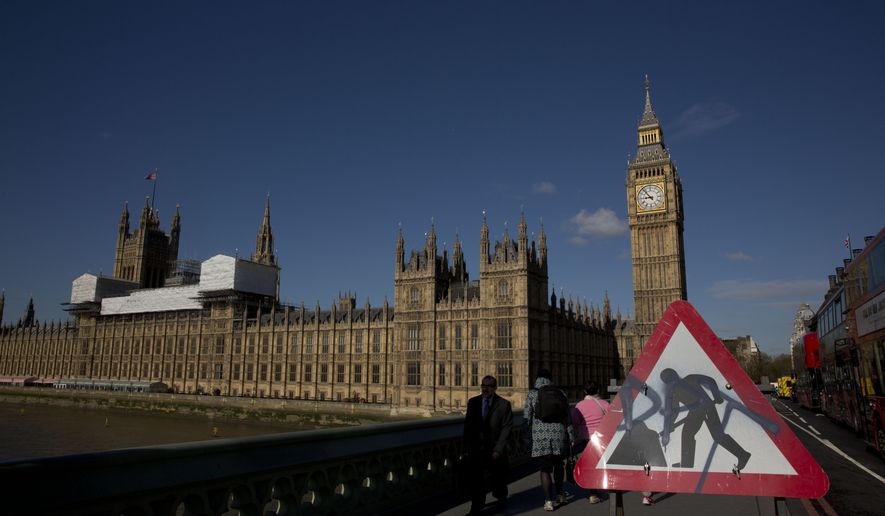 Westminster Bridge, near the Houses of Parliament and Elizabeth Tower, which houses the Big Ben bell in London, Tuesday, April 26, 2016. Officials say the chimes of Britain&#x27;s Big Ben bell will fall silent for several months during a three-year restoration of Parliament&#x27;s crumbling clock tower. (AP Photo/Matt Dunham)