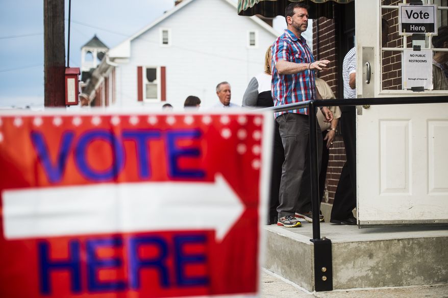 Voters line up to enter at the Hanover Market House polling station in the 2nd Ward Tuesday morning, April 26, 2016, in Hanover, Pa., borough. Pennsylvania voters went to the polls Tuesday with strong views about who should be president. (Shane Dunlap/The Evening Sun via AP)