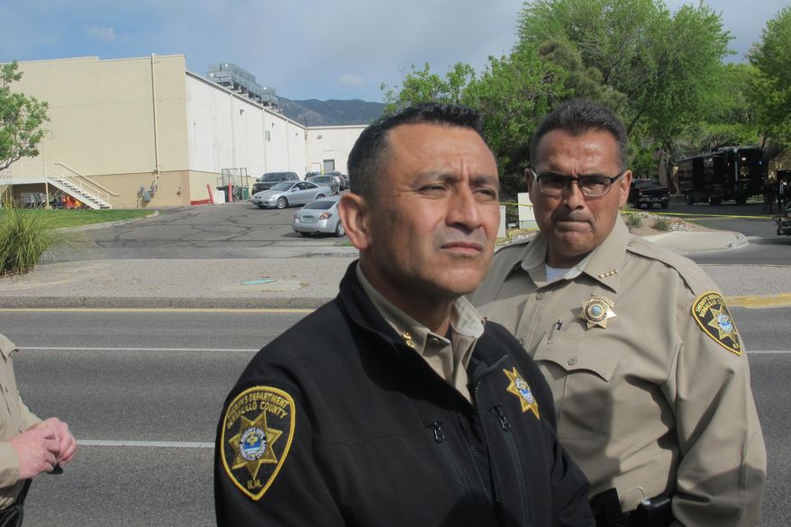 Bernalillo County Sheriff Manuel Gonzales discusses an officer-involved shooting that killed a suspect wanted on an arrest warrant at an apartment complex in Albuquerque, N. M., Tuesday, April 26, 2016. No law enforcement officers were injured or wounded in the shooting. (AP Photo/Mary Hudetz)