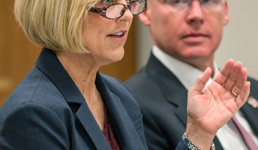 TennCare Director Wendy Long and her predecessor Darin Gordon attend a health care task force meeting in Nashville, Tenn., on Tuesday, April 26, 2016. The panel was appointed by Republican House Speaker Beth Harwell to come up with proposals to expand access to health coverage following the defeat of Gov. Bill Haslam’s Insure Tennessee proposal last year. (AP Photo/Erik Schelzig)