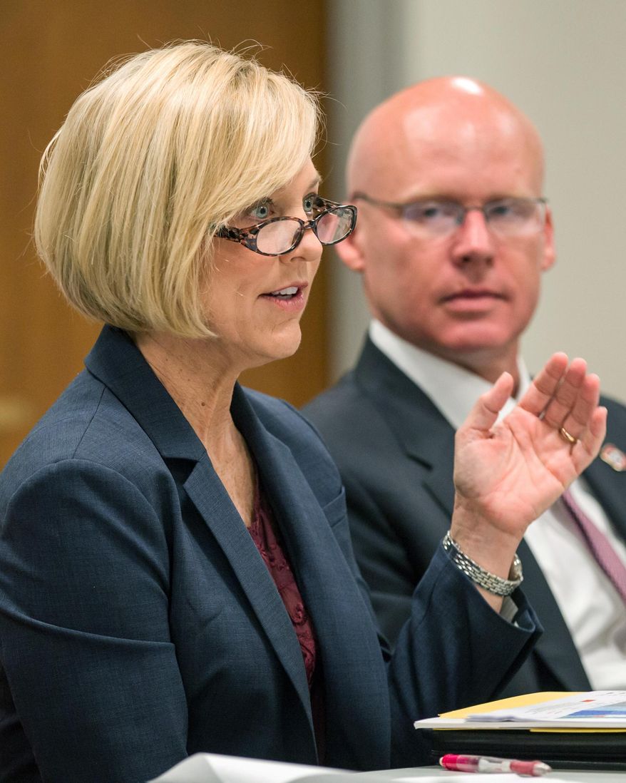 TennCare Director Wendy Long and her predecessor Darin Gordon attend a health care task force meeting in Nashville, Tenn., on Tuesday, April 26, 2016. The panel was appointed by Republican House Speaker Beth Harwell to come up with proposals to expand access to health coverage following the defeat of Gov. Bill Haslam’s Insure Tennessee proposal last year. (AP Photo/Erik Schelzig)