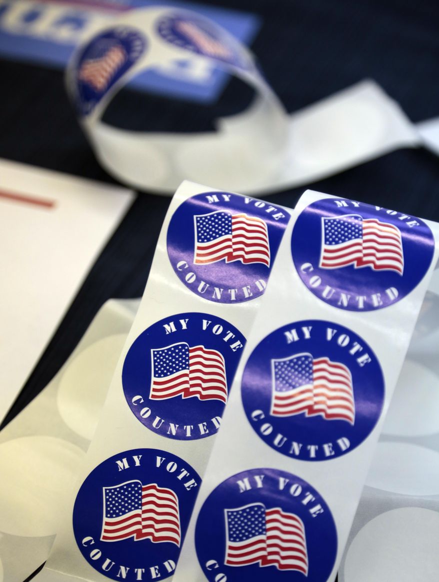 Stickers for voters are seen on a table at a polling station Tuesday, April 26, 2016 in Wayne, Pa. Attention is shifting from a well-worn campaign trail to the voting booths as Pennsylvanians cast ballots Tuesday on presidential primary contests, including the first competitive Republican primary in decades, and races for Congress and state offices. (AP Photo/Jacqueline Larma)