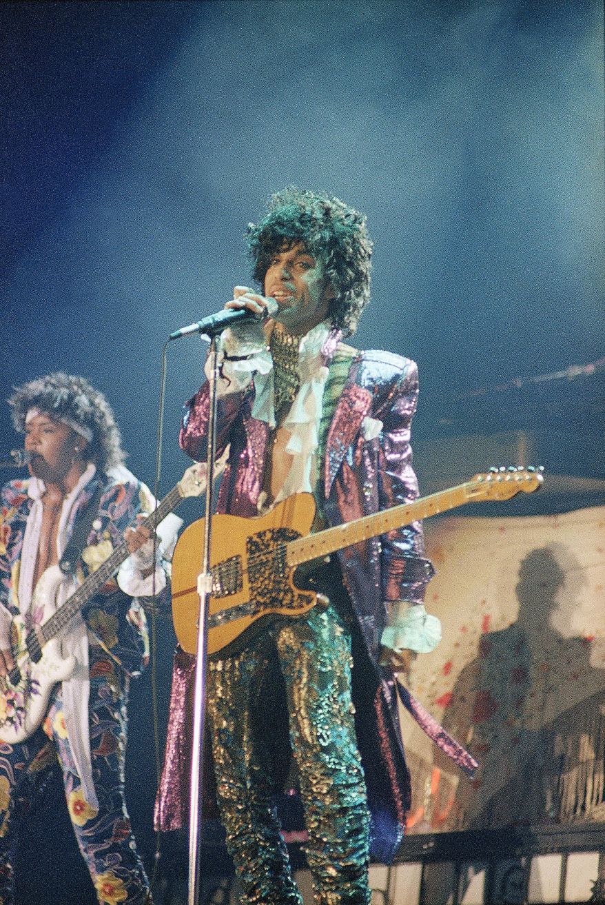 FILE - In this 1985 file photo, singer Prince performs in concert. Prince's old band is reuniting for some live shows following his death. Members of the Revolution made the announcement in a video posted online Tuesday, April 26, 2016. (AP Photo, File)