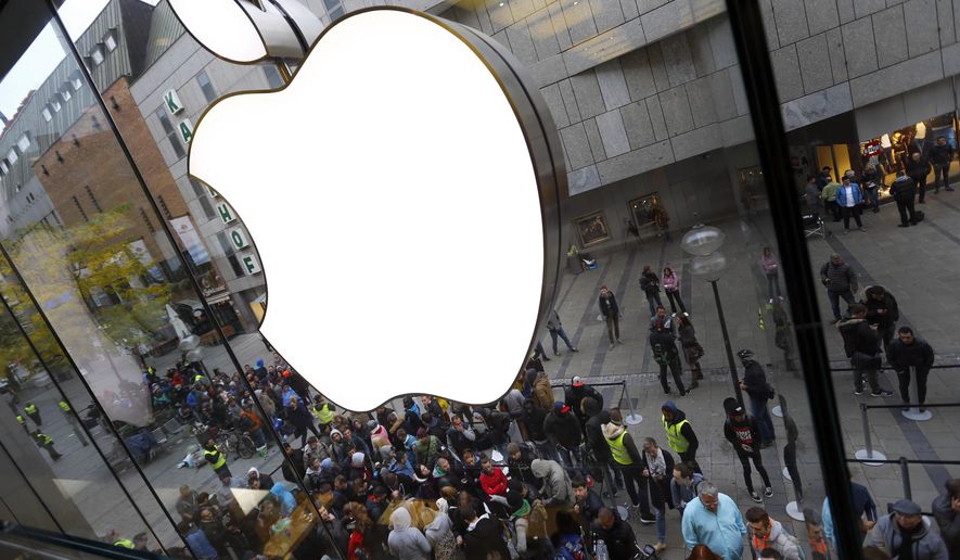 FILE - In this Friday, Sept. 25, 2015, file photo, people wait in front of the Apple store in Munich, before the worldwide launch of the iPhone 6s. On Tuesday, April 26, 2016, Apple reported that quarterly revenue fell for the first time in more than a decade, as iPhone sales fell compared with a year ago. That's putting more pressure on the world's most valuable public company to come up with its next big product. (AP Photo/Matthias Schrader, File)