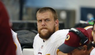 Washington Redskins offensive guard Brandon Scherff (75) watches from the bench during the second half of an NFL football game against the Chicago Bears, Sunday, Dec. 13, 2015, in Chicago. (AP Photo/Charles Rex Arbogast) ** FILE **