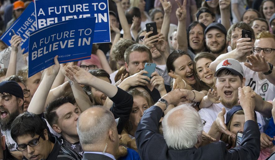 Democratic presidential candidate Sen. Bernie Sanders, I-Vt., greets with audience members during an election night campaign event at the Big Sandy Superstore Arena, Tuesday, April 26, 2016, in Huntington, W.Va. (AP Photo/John Minchillo)