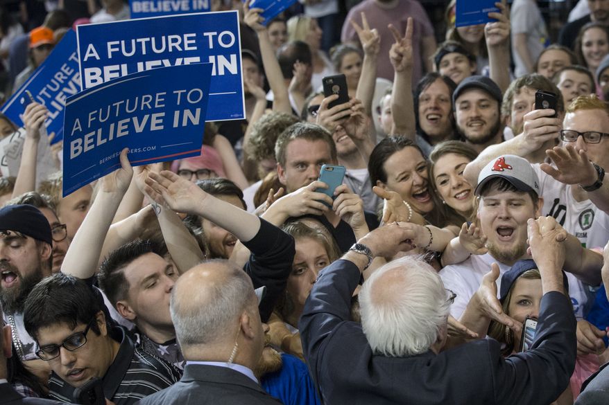 Democratic presidential candidate Sen. Bernie Sanders, I-Vt., greets with audience members during an election night campaign event at the Big Sandy Superstore Arena, Tuesday, April 26, 2016, in Huntington, W.Va. (AP Photo/John Minchillo)
