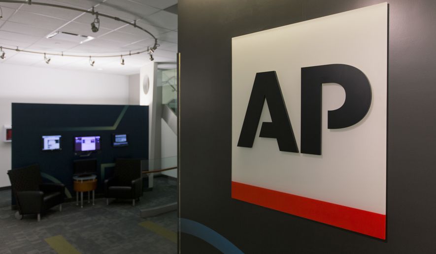 A logo for The Associated Press is seen at its headquarters in New York on Tuesday, April 26, 2016. AP&#39;s earnings rose 30 percent last year as the news cooperative recorded a huge tax gain and cut costs to help offset a revenue downturn reflecting the long-running financial woes plaguing newspapers and other media. (AP Photo/Hiro Komae)
