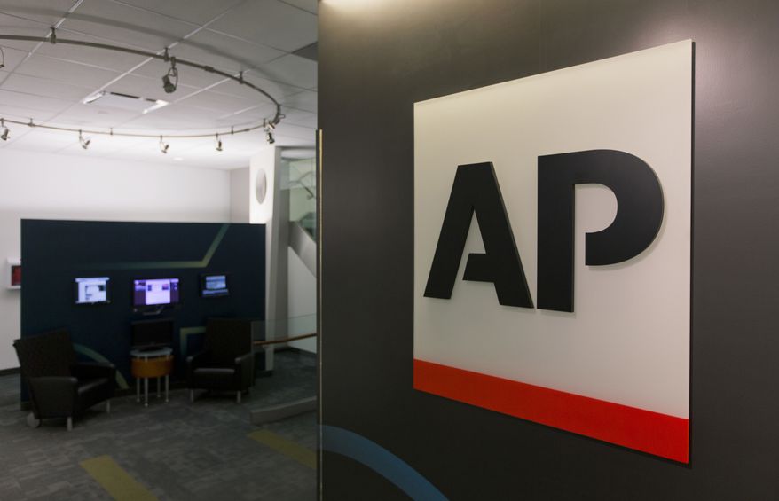 A logo for The Associated Press is seen at its headquarters in New York on Tuesday, April 26, 2016. AP&#x27;s earnings rose 30 percent last year as the news cooperative recorded a huge tax gain and cut costs to help offset a revenue downturn reflecting the long-running financial woes plaguing newspapers and other media. (AP Photo/Hiro Komae)