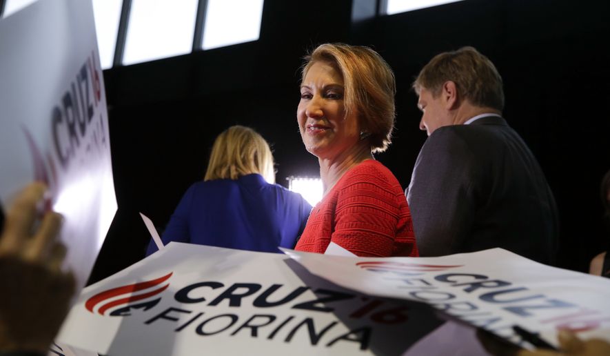 Former Hewlett-Packard CEO Carly Fiorina pauses as she signs campaign posters following a rally for Republican presidential candidate Sen. Ted Cruz, R-Texas, in Indianapolis, Wednesday, April 27, 2016.  Cruz chose Fiorina as his running mate.  (AP Photo/Michael Conroy)