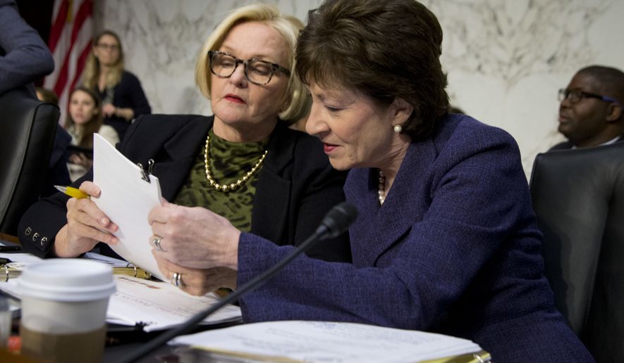 Senate Special Committee on Aging Chair Sen. Susan Collins, R-Maine, right, and the committee&#39;s ranking member Sen. Claire McCaskill, D-Mo., confer on Capitol Hill in Washington, Wednesday, April 27, 2016, prior to the start of their committee&#39;s hearing on drastic price hikes by Valeant and a handful of other drugmakers that have stoked outrage from patients, physicians and politicians nationwide. (AP Photo/Manuel Balce Ceneta)