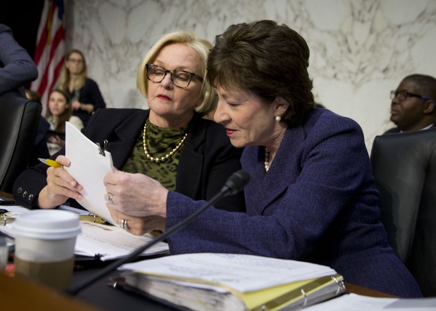 Senate Special Committee on Aging Chair Sen. Susan Collins, R-Maine, right, and the committee&#39;s ranking member Sen. Claire McCaskill, D-Mo., confer on Capitol Hill in Washington, Wednesday, April 27, 2016, prior to the start of their committee&#39;s hearing on drastic price hikes by Valeant and a handful of other drugmakers that have stoked outrage from patients, physicians and politicians nationwide. (AP Photo/Manuel Balce Ceneta)