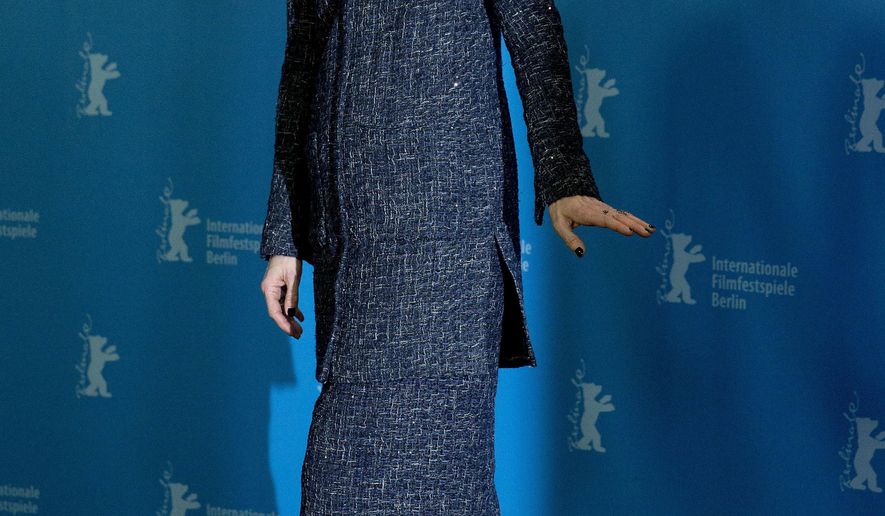 FILE - In this Thursday, Feb. 11, 2016 file photo, actress Tilda Swinton leaves after a photo call for the film 'Hail Caesar' at the 2016 Berlinale Film Festival in Berlin, Germany. One of the screenwriters of the film "Doctor Strange" has suggested that the casting of British actress Tilda Swinton as sorcerer the Ancient One, who is a Tibetan male character in the "Doctor Strange" comic books, was partly done to avoid potentially offending China's government and moviegoers, who now represent the world's second-largest annual box office after North America. (AP Photo/Axel Schmidt, File)