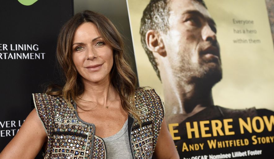 FILE - In this April 5, 2016 file photo, Vashti Whitfield, widow of actor Andy Whitfield, poses at the premiere of the film "Be Here Now (The Andy Whitfield Story)," in Beverly Hills, Calif. Andy Whitfield died of non-Hodgkin lymphoma in 2011. (Photo by Chris Pizzello/Invision/AP, File)