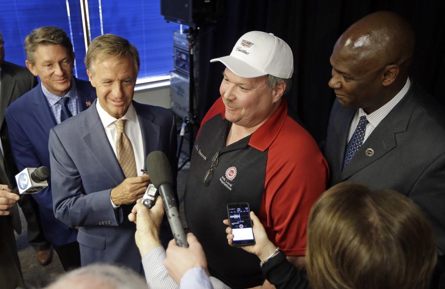 Tennessee Gov. Bill Haslam, second from left, talks with reporters after an announcement Wednesday, April 27, 2016, in Spring Hill, Tenn., that General Motors will invest $790 million at its plant in Spring Hill and another $118 million in Bay City, Mich. (AP Photo/Mark Humphrey) ** FILE **