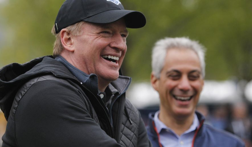 NFL Commissioner Roger Goodell, left,  laughs with Chicago Mayor Rahm Emanuel during an NFL Play 60 event at Grant Park, Wednesday, April 27, 2016, in Chicago before Thursday&#x27;s first round of the NFL football draft. (AP Photo/Kiichiro Sato)