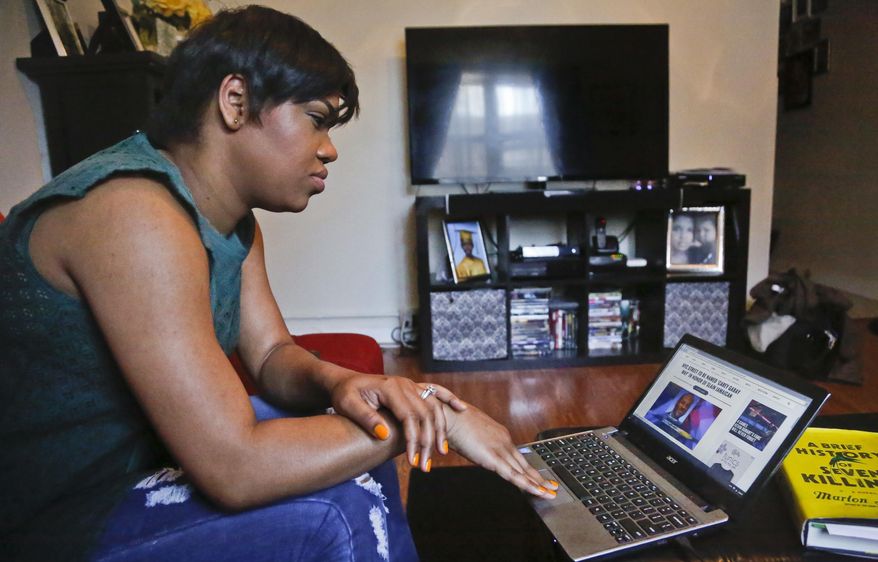Jay Blessed, who listened to various unlicensed stations when she moved from Trinidad to Brooklyn more than a decade ago and broadcasted her own online radio show, prepare to update her blog she says will interface with her new podcast program, Sunday, April 24, 2016, in New York. Federal lawmakers and broadcasters are increasingly worried about pirate radio's presence in some cities as unlicensed broadcasters commandeer frequencies to play anything. (AP Photo/Bebeto Matthews)