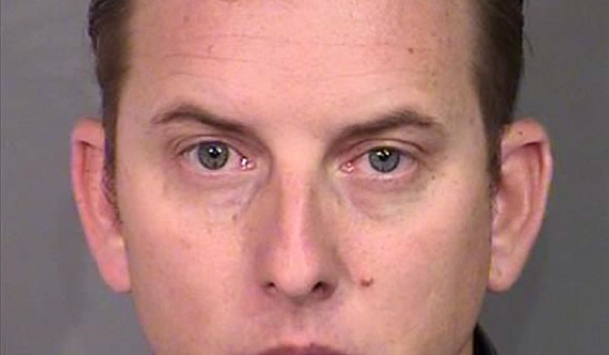 This undated photo provided Wednesday, April 27, 2016, by the Nevada state attorney general's office shows Las Vegas Police K-9 Officer Jeff Lynn Harper. Harper is facing multiple felony charges alleging that he burned his recreational vehicle trailer in January for the insurance money. A police spokeswoman says Harper will be suspended without pay pending the outcome of his case.(Nevada Attorney General via AP)