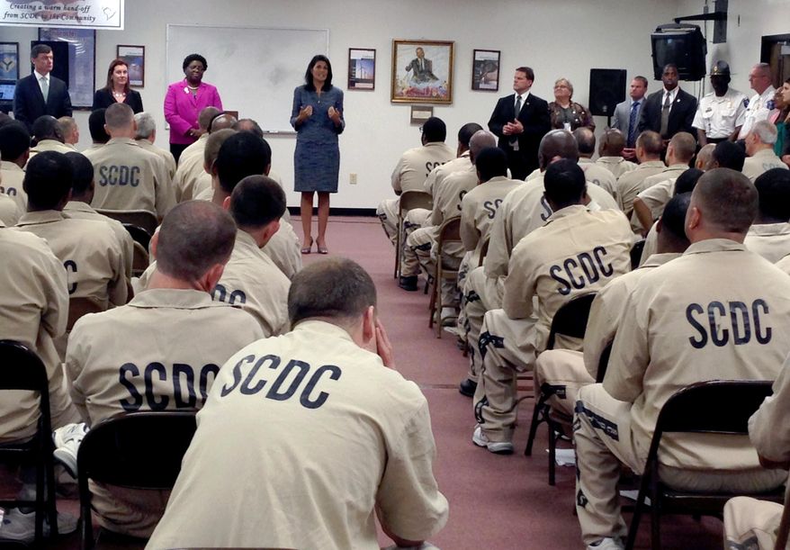 South Carolina Gov. Nikki Haley talks to inmates at Manning Correctional institution Monday, April 25, 2016, in Columbia, S.C., who are scheduled to be released. Haley told prisoners Monday a better life beyond the barbed-wire fencing starts with a legal job, and it's her job to help them find one. (AP Photo/Seanna Adcox)
