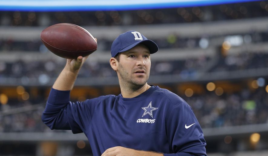 In this Nov. 1, 2015, file photo, Injured Dallas Cowboys quarterback Tony Romo tosses a football prior to the team&#39;s NFL football game against the Seattle Seahawks in Arlington, Texas. (AP Photo/Brandon Wade, File)