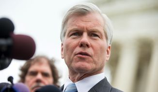 Former Virginia Gov. Bob McDonnell speaks outside the Supreme Court in Washington, Wednesday, April 27, 2016, after the Supreme Court heard oral arguments on the corruption case of McDonnell. The Supreme Court seems likely to overturn the conviction of McDonnell on political corruption charges and place new limits on the reach of federal bribery laws. (AP Photo/Andrew Harnik)