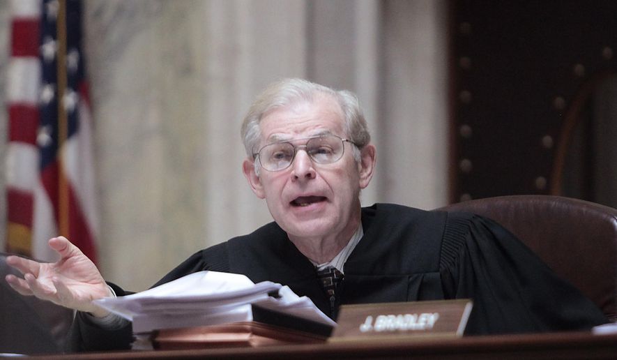 FILE - This June 6, 2011 photo shows Wisconsin Supreme Court Justice David Prosser posing a question to Dane County Circuit Court Representative Marie A. Stanton during a hearing at the Wisconsin State Capitol. Prosser announced his retirement Wednesday, April 27, 2016, in a news release from the court. (AP Photo/John Hart, Pool, File)