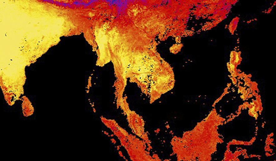 This image released by NASA's Earth Observatory Team from data collected by the Moderate Resolution Imaging Spectroradiometer (MODIS), an instrument on NASA's Terra and Aqua satellites, shows the land surface temperature as observed by MODIS in Thailand, center, and surrounding countries between April 15 to April 23, 2016. Yellow shows the warmest temperatures. April in Thailand is typically hot and sweaty but his year's scorching weather has set a record for the longest heat wave in at least 65 years. (Reto Stockli/NASA Earth Observatory Team/MODIS Land Science Team via AP) MANDATORY CREDIT