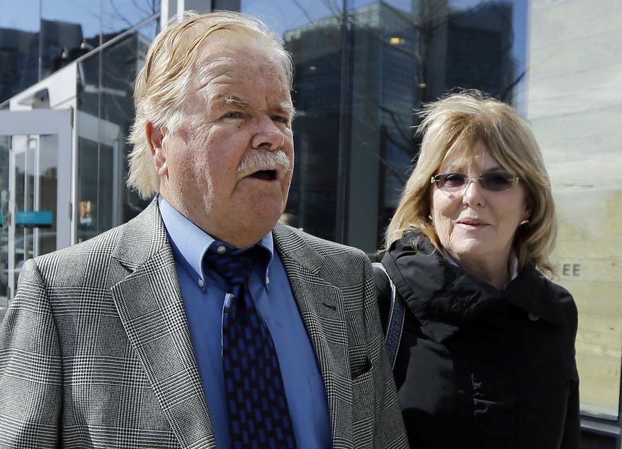 FILE - In this April 30, 2015 file photo, Robert Fitzpatrick, of Charlestown, R.I., walks from federal court in Boston with his wife Jane. Fitzpatrick, a former FBI agent, pleaded not guilty to charges of perjury during James "Whitey" Bulger's trial. Lawyers for Fitzpatrick and federal prosecutors filed papers in court Wednesday, April 27, 2016, asking a judge to schedule a change-of-plea hearing for May 5. (AP Photo/Elise Amendola)
