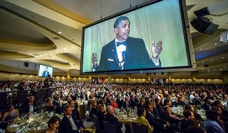 Then-President Barack Obama takes to the dais during the White House Correspondents&#39; dinner. (J.M Eddins for White House Correspondents&#39; Association) ** FILE **