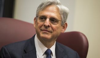 Judge Merrick Garland, President Barack Obama&#39;s choice to replace the late Justice Antonin Scalia on the Supreme Court meets with Sen. Gary Peters, D-Mich., on Capitol Hill, on Thursday, April 28, 2016, in Washington. (AP Photo/Evan Vucci)