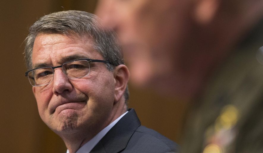 Defense Secretary Ash Carter listens at left as Joint Chiefs Chairman Gen. Joseph Dunford testifies on Capitol Hill in Washington, Thursday, April 28, 2016, before the Senate Armed Services Committee hearing on the Islamic State group. Sen. John McCain, R-Ariz., the chairman of the GOP-led Armed Services Committee is calling the U.S. response to the extremists reactive, slow, and insufficient. (AP Photo/Evan Vucci)
