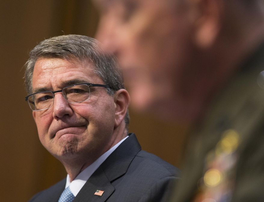 Defense Secretary Ash Carter listens at left as Joint Chiefs Chairman Gen. Joseph Dunford testifies on Capitol Hill in Washington, Thursday, April 28, 2016, before the Senate Armed Services Committee hearing on the Islamic State group. Sen. John McCain, R-Ariz., the chairman of the GOP-led Armed Services Committee is calling the U.S. response to the extremists reactive, slow, and insufficient. (AP Photo/Evan Vucci)