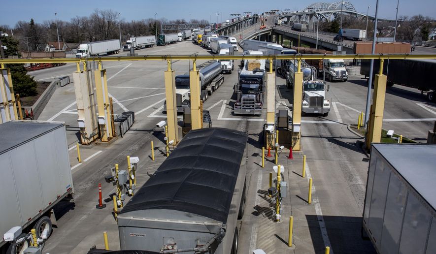 In this April 27, 2016 photo, vehicles travel cross the Blue Water Bridges in Port Huron, Mich. The Michigan Department of Transportation is seeking about $50 million in federal grant money to fund the long-delayed expansion of the Blue Water Bridge plaza. (Jeffrey M. Smith/The Times Herald via AP) NO SALES; MANDATORY CREDIT