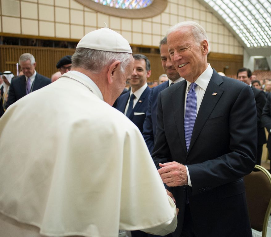 Pope Francis shakes hands with US vice president Joe Biden as he takes part at a congress on the progress of regenerative medicine and its cultural impact, being held in the Pope Paul VI hall at the Vatican, Friday, April 29, 2016. (L&#39;Osservatore Romano/Pool photo via AP)
