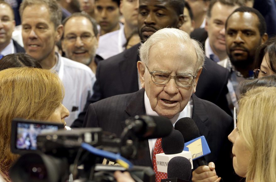 Berkshire Hathaway Chairman and CEO Warren Buffett tours the exhibit floor before presiding over the annual shareholders meeting Saturday, April 30, 2016, in Omaha, Neb. (AP Photo/Charlie Riedel)