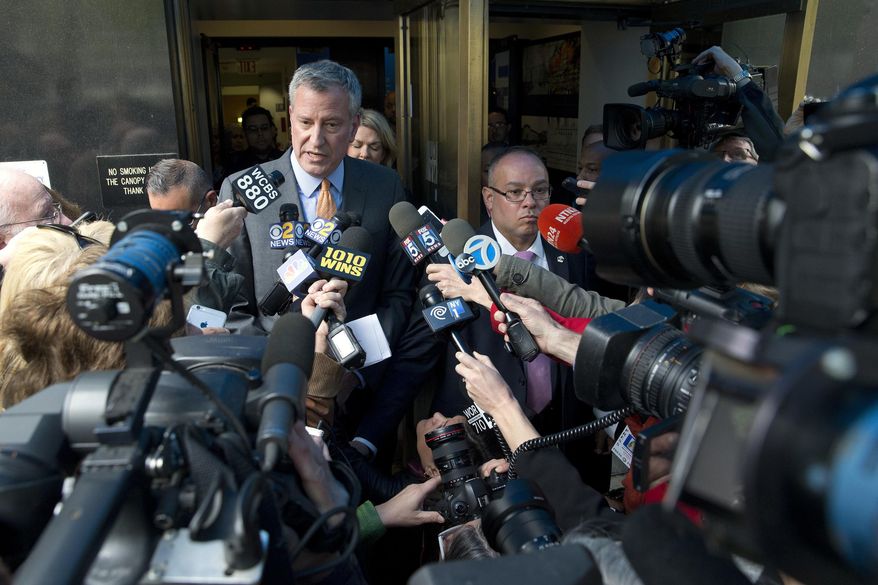FILE - In this April 28, 2016 file photo, New York City Mayor Bill de Blasio is surrounded by reporters as he leaves an event in New York after some of his aides were subpoenaed by state and federal prosecutors amid investigations into his campaign fundraising operation. A failed effort by New York City's mayor and a network of allies to elect three Democratic state senators in 2014 is under criminal investigation for financial practices their lawyer calls both legal and common. (AP Photo/Mary Altaffer, File)