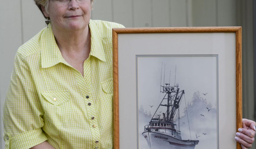 In this photo taken Wednesday, April 20, 2016, Laurie Hart poses with a painting of her brother Mark Coulthurst&#x27;s fishing vessel the Investor  painted by local artist James Williamson, at her home in Blaine, Wash. home. Almost 34 years ago, Mark Coulthurst, 28, the Investor’s skipper; his pregnant wife, Irene Coulthurst, also 28; their two children, Kimberly, 5, and John, 4; and Michael Stewart, 19, of Bellingham, a cousin of Mark Coulthurst, were killed aboard the Investor, a purse seiner found ablaze Sept. 7, 1982, near Craig, a fishing village in Southeast Alaska. (Philip A. Dwyer/The Bellingham Herald via AP) MANDATORY CREDIT