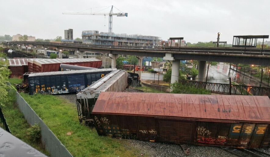 Several cars remain overturned after a CSX freight train derailed in Washington on Sunday, May 1, 2016. (DC Fire and EMS via AP) MANDATORY CREDIT