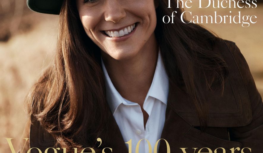 In this handout photo provided by British Vogue on Sunday, May 1, 2016, Kate, the Duchess of Cambridge poses in Norfolk, England, for the magazine's centenary issue. (Josh Olins/British Vogue via AP)