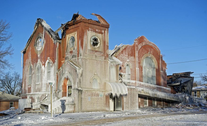 ADVANCE FOR RELEASE SUNDAY, MAY 1, 2016, AT 12:01 A.M. CDT. AND THEREAFTER - In this Jan. 6, 2014 photo, covered in ice and with hot spots still smoldering, the shell of the United Methodist Church remains in Syracuse, Neb. While the old structure is gone, the congregation remains and with it a seed ready to be planted in that dirt to grow a new building they envision as a vibrant community center, meeting space, child care center and place of worship. (Kristin Streff/The Journal-Star via AP) LOCAL TELEVISION OUT; KOLN-TV OUT; KGIN-TV OUT; KLKN-TV OUT; MANDATORY CREDIT