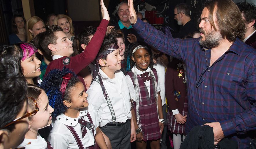 Actor Jack Black, right, meets backstage with cast members of Broadway's "School of Rock" after watching a performance at the Winter Garden Theatre on Sunday, May, 1, 2016, in New York. (Photo by Charles Sykes/Invision/AP)