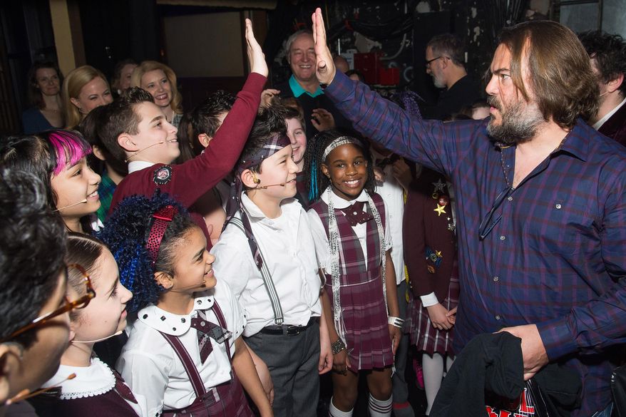 Actor Jack Black, right, meets backstage with cast members of Broadway's "School of Rock" after watching a performance at the Winter Garden Theatre on Sunday, May, 1, 2016, in New York. (Photo by Charles Sykes/Invision/AP)