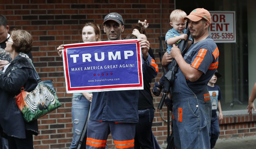 Coal miner Chris Steele showed support for Republican presidential candidate Donald Trump outside a campaign event in May for Democratic nominee Hillary Clinton in Williamson, West Virginia. (Associated Press)