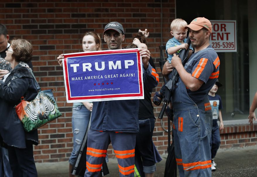 Coal miner Chris Steele showed support for Republican presidential candidate Donald Trump outside a campaign event in May for Democratic nominee Hillary Clinton in Williamson, West Virginia. (Associated Press)