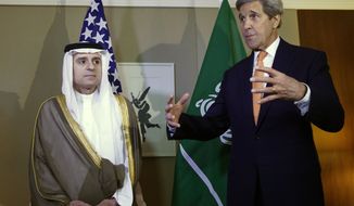 U.S. Secretary of State John Kerry, right, gestures next to Saudi Foreign Minister Adel al-Jubeir, left, during a meeting on Syria in Geneva, Switzerland, May 2, 2016. (Denis Balibouse/Pool Photo via AP)