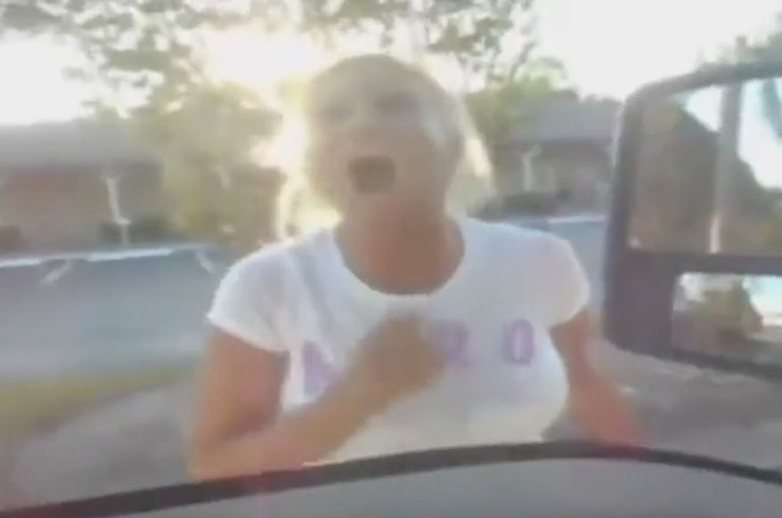 Tracy Weiss, a Florida sheriff's deputy, has been reassigned after she was caught on camera berating a tow truck driver and threatening to have him arrested as he towed her illegally parked vehicle. (Universal Towing)