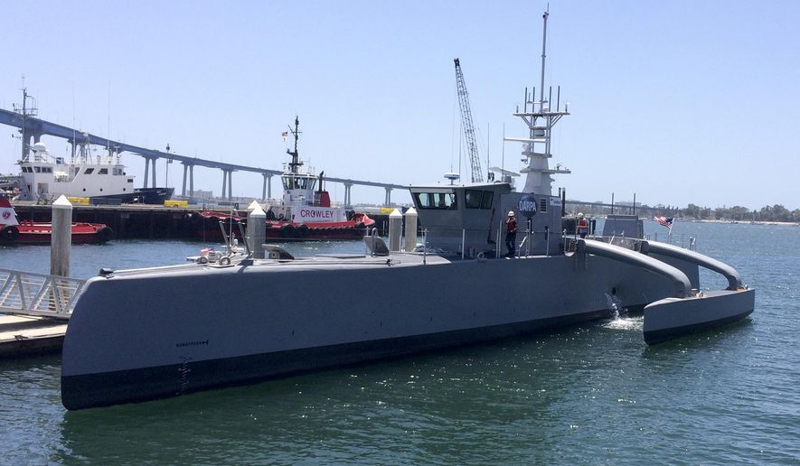A self-driving, 132-foot military ship sits at a maritime terminal Monday, May 2, 2016, in San Diego. The Pentagon's research arm is launching tests on the world's largest unmanned surface vessel designed to travel thousands of miles out at sea without a single crew member on board. (AP Photo/Julie Watson)