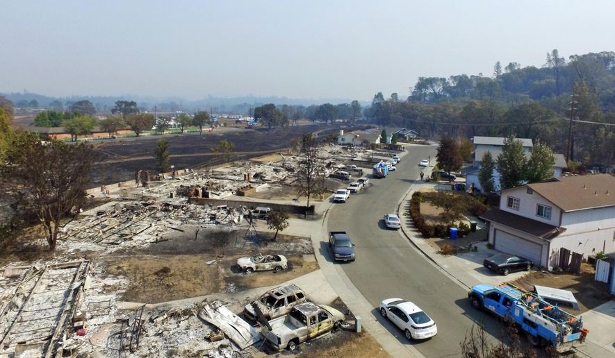 FILE -- This Sept. 15, 2015 file photo, taken with a drone, shows a street in Middletown, Calif., where several homes were completely destroyed by the Lake County wildfire. The number of new housing units in California declined last year for the first time since the start of the economic recovery, due mostly to wildfires that scorched more that 2,000 homes in Lake and Calaveras counties. (AP Photo/Brian Skoloff, File)