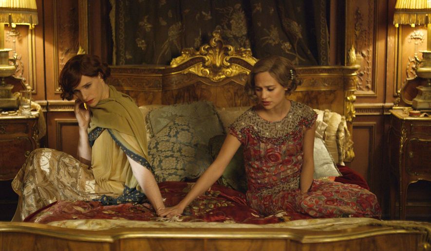 FILE - This file photo provided by Focus Features shows, Eddie Redmayne, left, as Lili Elbe, and Alicia Vikander as Gerda Wegener, in Tom Hooper’s "The Danish Girl." Hollywood films remained static in their inclusiveness of LGBT characters in 2015, but the racial diversity of those characters fell dramatically, according to the findings of GLAAD's annual study released on Monday, May 2, 2016. The studios' art house divisions, like Focus Features and Fox Searchlight, fared better overall with releases like "The Danish Girl," ''Grandma" and "Chi-Raq." (Agatha A. Nitecka/Focus Features via AP, File)