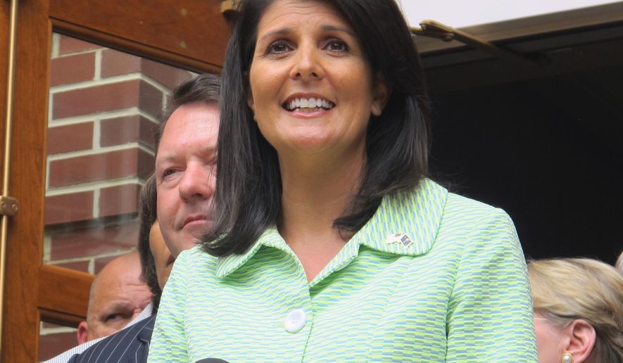 South Carolina Gov. Nikki Haley speaks with reporters outside the Jasper County office building in Ridgeland, S.C., on Monday, May 2, 2016, after a briefing on a $4.5 billion container terminal South Carolina and Georgia are jointly building on the Savannah River. Haley said lawmakers in both states will soon need to begin banking money to help pay for the 1,500-acre project. Planners say the first phase needs to open by 2025. (AP Photo/Bruce Smith)